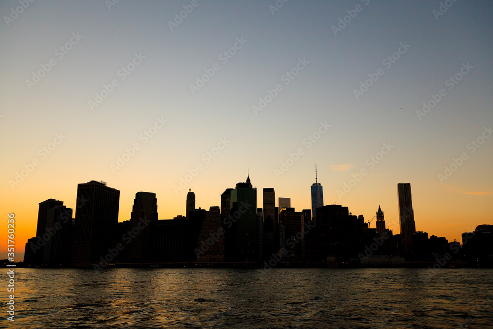 Manhattan: Sunset Lower Manhattan through East River from Brooklyn