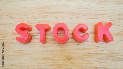 letter stock on wood background