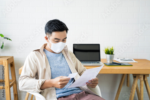 Working from home web designing graphical user interface UX UI, in office brainstorming concepts designing creative planning innovative ideas, protective facemask quarantine coronavirus covid-19 photo