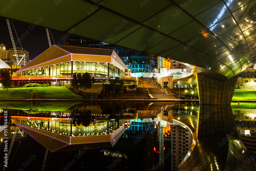 A night cityscsape taken under the river torrens footbridge on a very calm night in Adelaide South Australia  taken on the 21st May 2020
