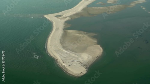 Aerial view of sandbar amidst sea, beautiful beach seen through airplane - Sossusvlei, Namibia photo