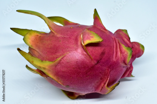 Ripe pink dragon fruit isolated on a white background.