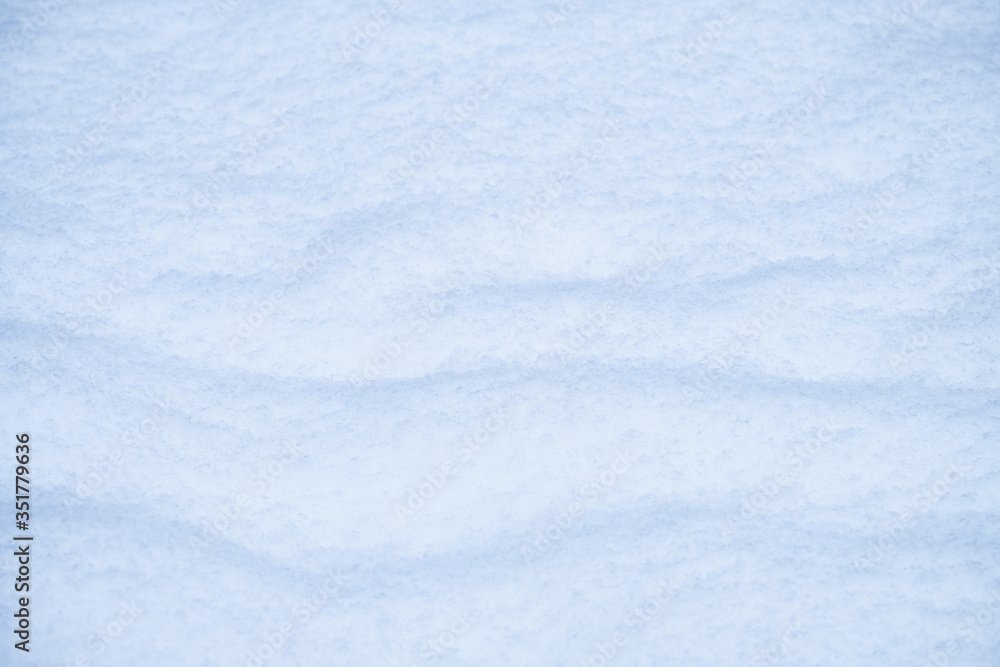 Snow texture. Natural winter background with snow waves