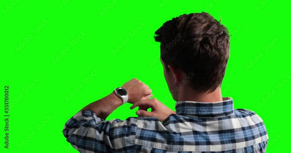 Animation of a man checking his smartwatch in a green background Animation of a man checking his smartwatch in a green background