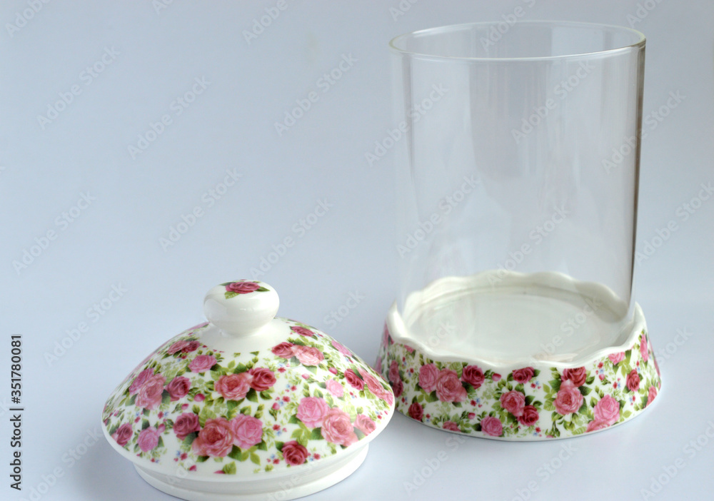 An empty glass food container isolated from a white background An empty glass food container isolated from a white background