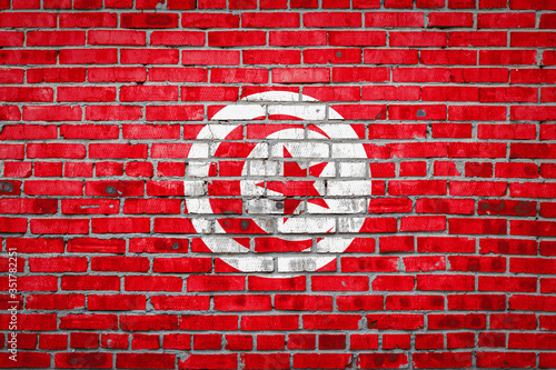 Flag banner on brick wall background.