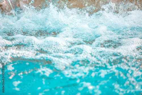Abstract image of blue fresh water from fountain or swimming pool with high shutter speed. for background textured or backdrop.