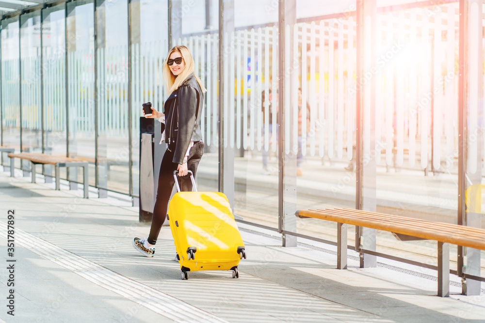 Εκτύπωση καμβά Young blonde woman traveler millennial on bus or tram stop