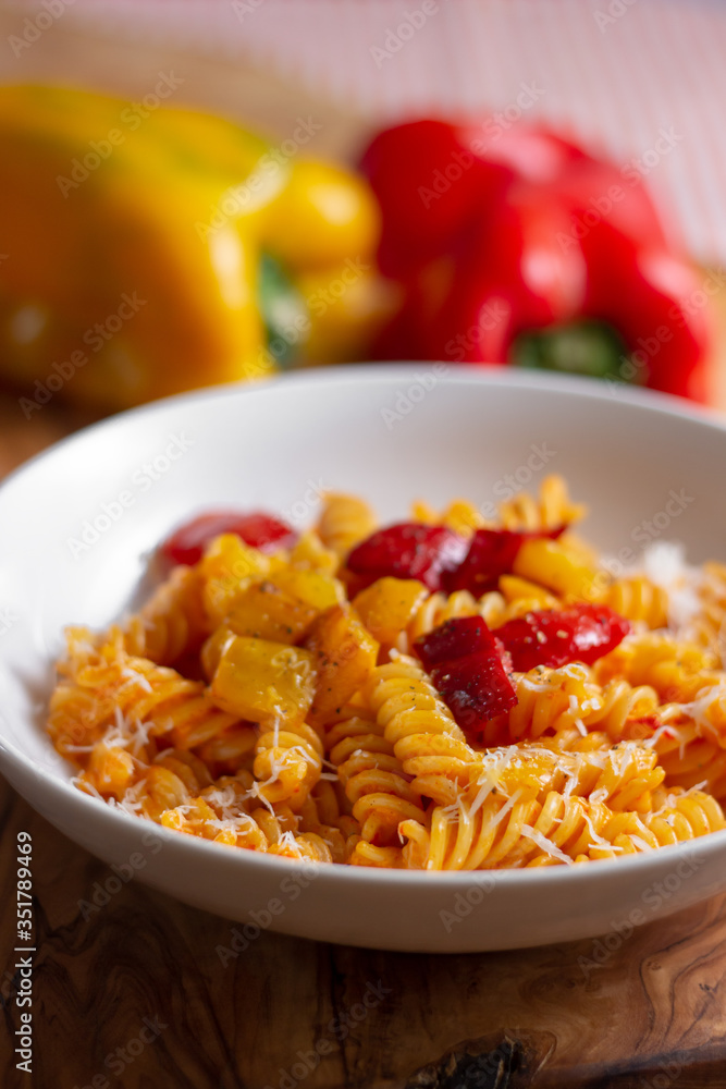 pasta with pepper cream and pieces of red and yellow pepper pasta with pepper cream and pieces of red and yellow pepper