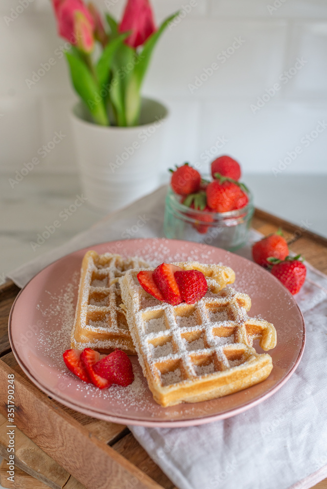 Tasty Belgian Waffles With Berries on a table Tasty Belgian Waffles With Berries on a table