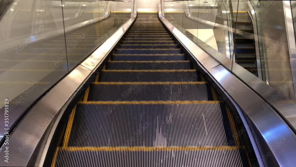 Empty escalator movement in the mall during corona virus outbreak or covid19 pandemic. Empty escalator movement in the mall during corona virus outbreak or covid19 pandemic.
