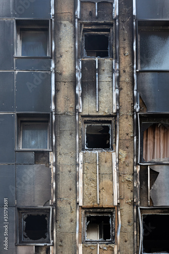 Facade of building with traces of fire