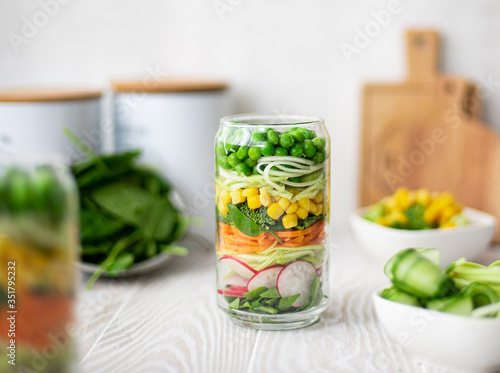 Fresh vegetable salad in a glass jar