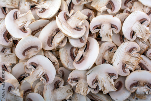 fresh sliced mushrooms close-up as background, top view