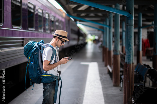 Traveler waits train at train station