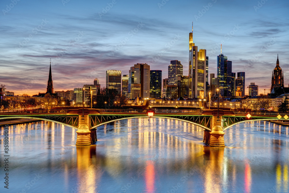 Dramatic sunset over downtown Frankfurt and the river Main