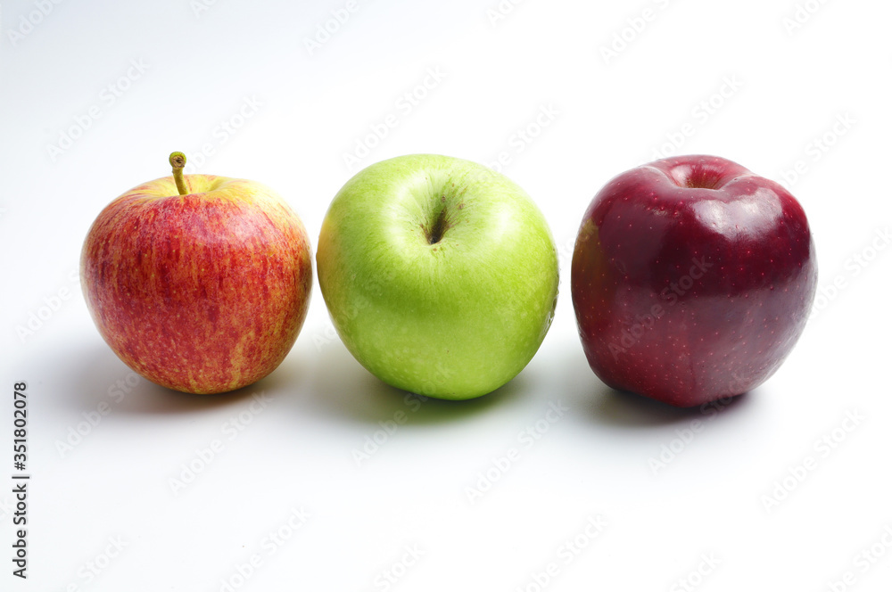 Three colors of apples on a white background Three colors of apples on a white background