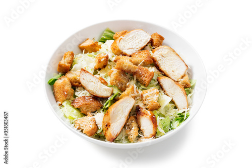 Classic caesar salad with grilled chicken fillet and parmesan cheese. isolated on white background