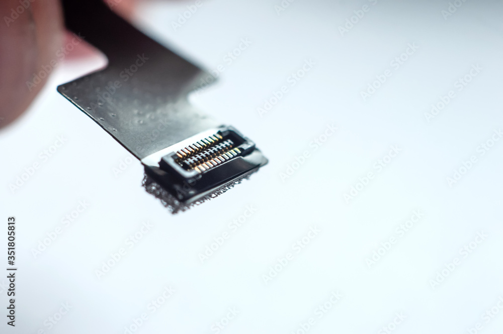Close-up flat cable flex cable on white background. Close-up flat cable flex cable on white background.
