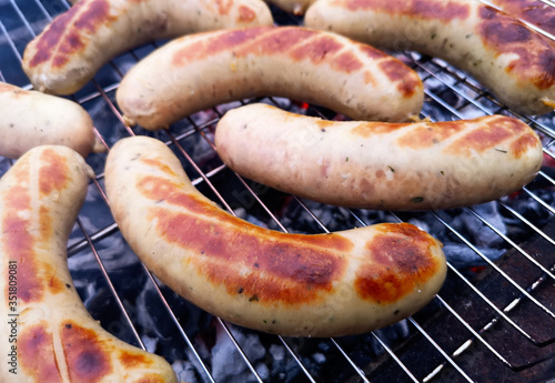 Juicy meat sausages are grilled.