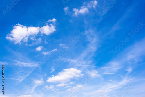Beautiful blue summer sky with clouds as a background