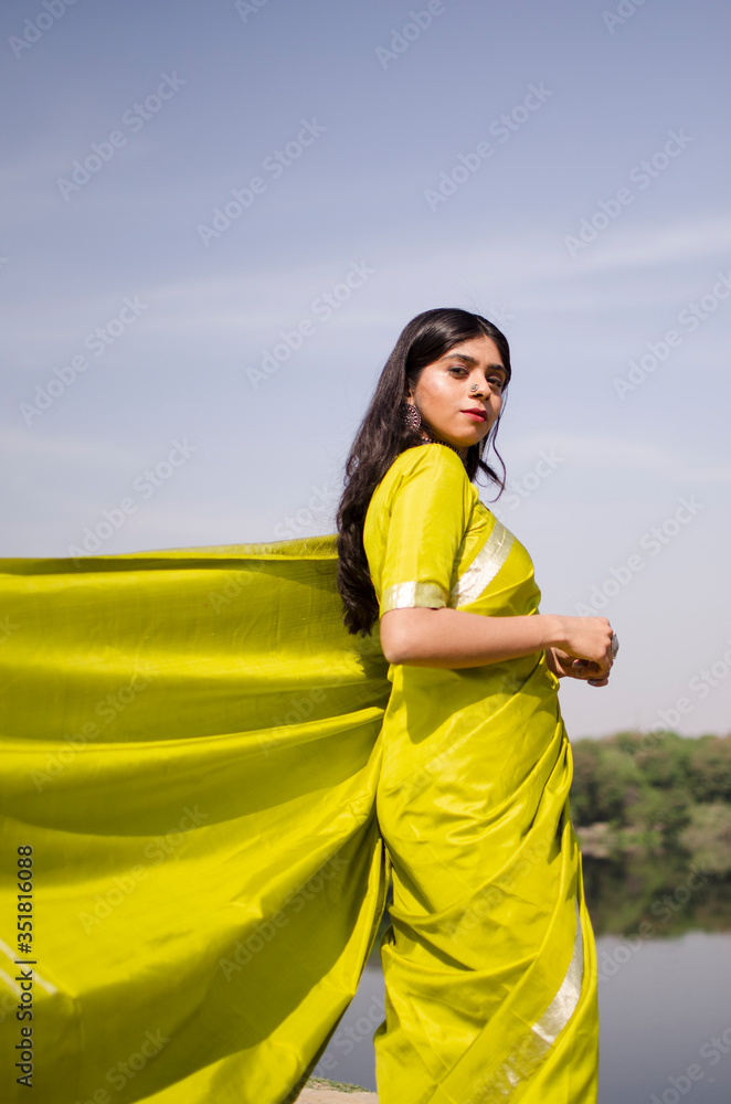 Indian girl wearing green saree standing in a landscape Stock Photo ...