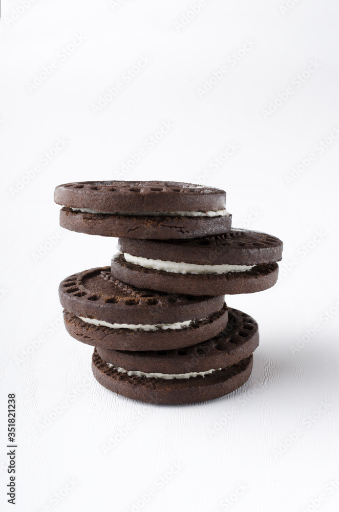 Closeup of stack of whole tasty sandwich cookies on the white background Closeup of stack of whole tasty sandwich cookies on the white background