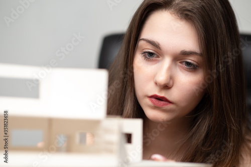 Girl architect with a house...