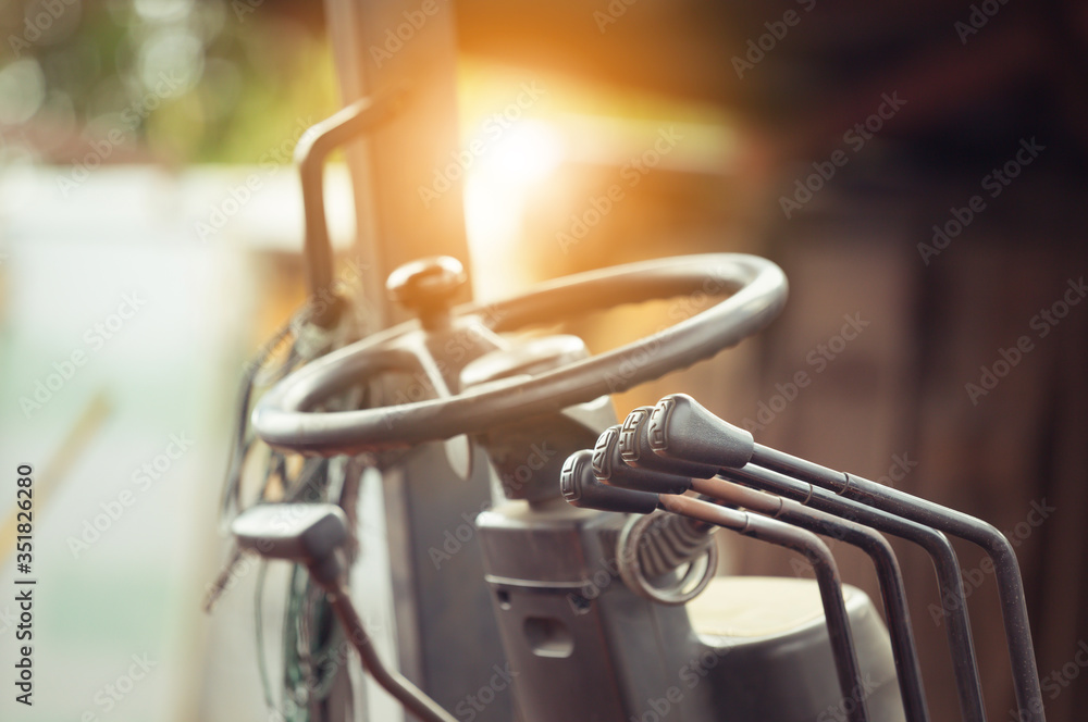 Close up of forklift gear stick and control knobs