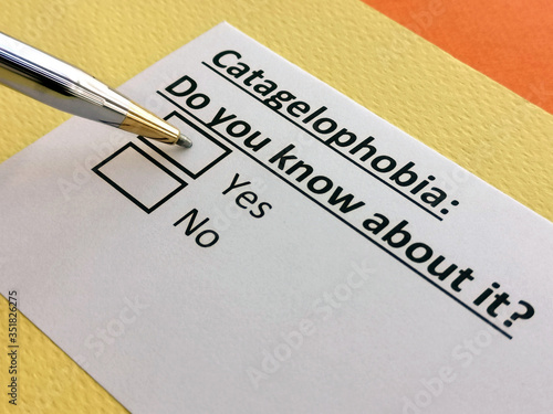 One person is answering question about catagelophobia. Catagelophobia is the fear of being ridiculed or being put down by someone. photo