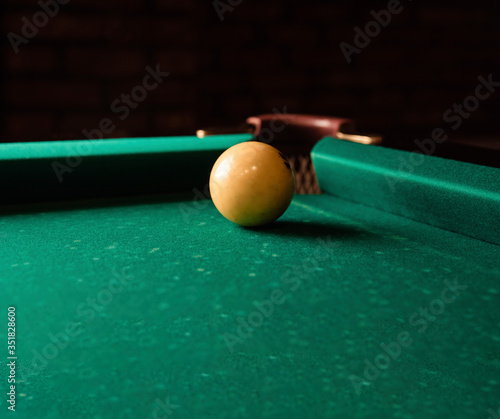 Wallpaper Mural Yellow billiard ball on green billiard table Torontodigital.ca