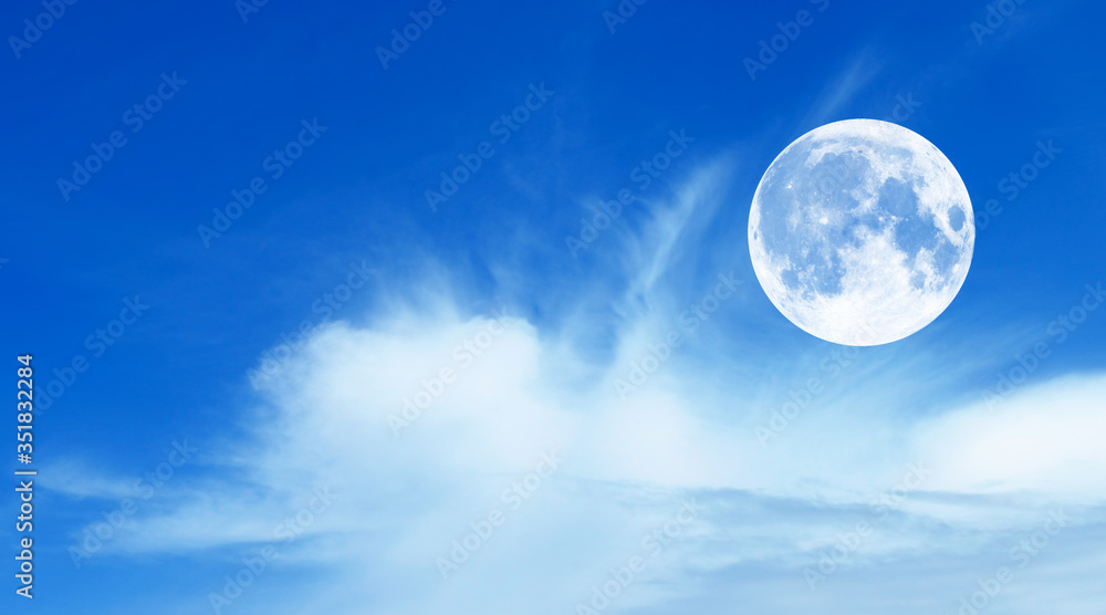 Blue sky with clouds and moon, natural background.