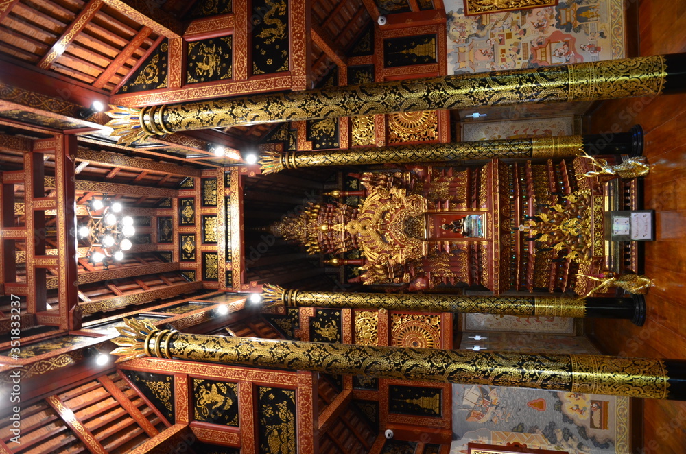Beautiful shrine with a copy of Chiang Mai's sacred Phra Singh Buddha at Wat Phra Singh in Chiang Rai