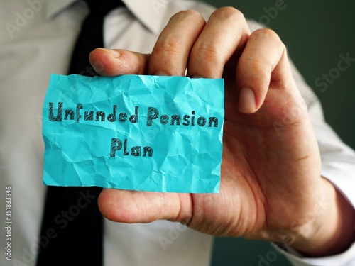 Financial concept about Unfunded Pension Plan with sign on the piece of paper. photo