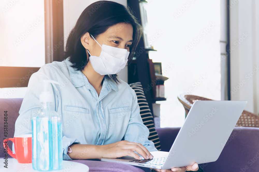 Business Woman Working from Home while She Have to Stay at Home for Self Quarantine. Corona Virus or COVID-19 Concept. Business Woman Working from Home while She Have to Stay at Home for Self Quarantine. Corona Virus or COVID-19 Concept.
