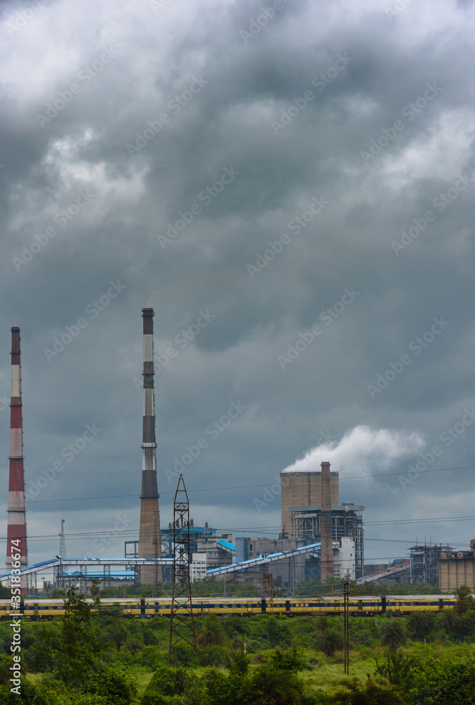 View of Cooling Tower and Chimneys with Moody Sky. View of Cooling Tower and Chimneys with Moody Sky.