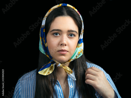 Portrait of young woman with headscarf. photo