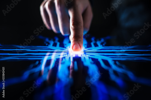 Digitalization Concept: Human Finger Pushes Touch Screen Button and Activates Futuristic Artificial Intelligence. Visualization of Machine Learning, AI, Computer Technology Merge with Humanity  photo
