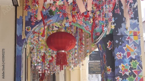 Lantern hanging on the ceiling with painted walls - static photo