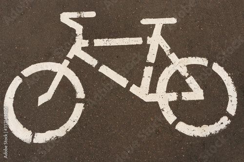 Drawing a bike. Bike sign. Bicycle sign on the asphalt. Designation of a bicycle path.