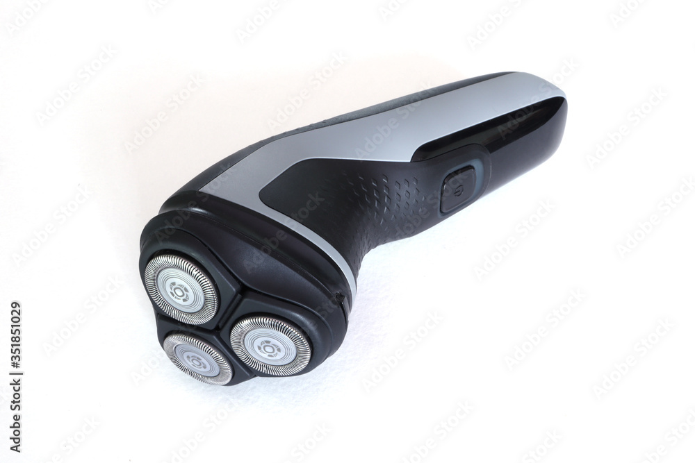 Electric shaver on White background. Isolated. Electric razor isolated on white. With shade. Electric shaver on White background. Isolated. Electric razor isolated on white. With shade.