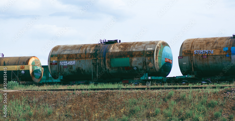 Old rusty cistern on a railway, industrial factory concept Old rusty cistern on a railway, industrial factory concept