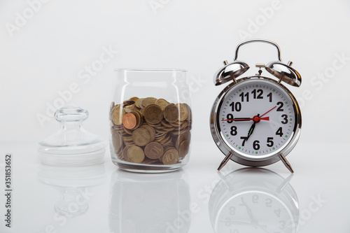 business financial ideas concept with coins stack and alarmclock isolate background with free copyspace for your creativity ideas text.