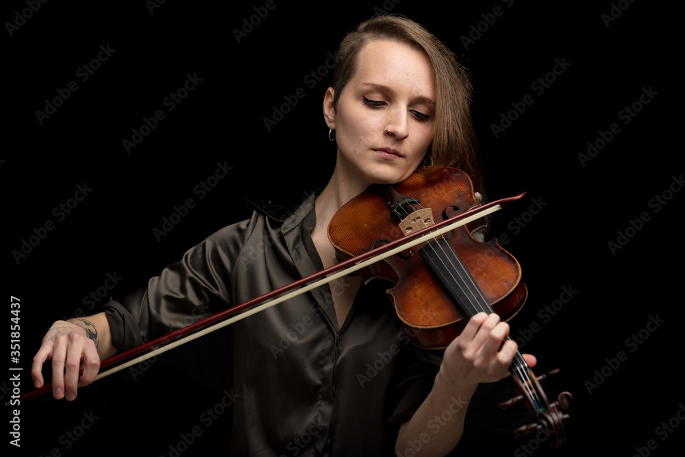 Professional female violinist playing in a concert