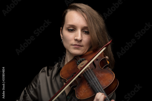 Dedicated woman playing a Baroque violin