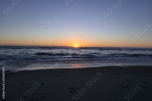 Far advanced sunset on a beach in New Zealand 