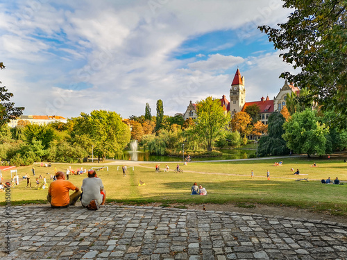People sitting and playing in Wroclaw Tolpa Park at sunny day