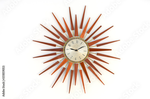 Fotografija Old vintage star or sun burst shaped wooden wall clock