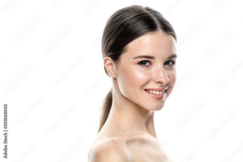 A close-up portrait of a girl with freckles and clear skin. Light blue eyes. The girl has different emotions, she looks at the camera. Isolated on a white background A close-up portrait of a girl with freckles and clear skin. Light blue eyes. The girl has different emotions, she looks at the camera. Isolated on a white background