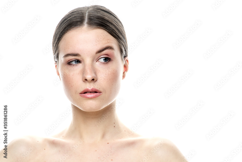 A close-up portrait of a girl with freckles and clear skin. Light blue eyes. The girl has different emotions, she looks at the camera. Isolated on a white background A close-up portrait of a girl with freckles and clear skin. Light blue eyes. The girl has different emotions, she looks at the camera. Isolated on a white background